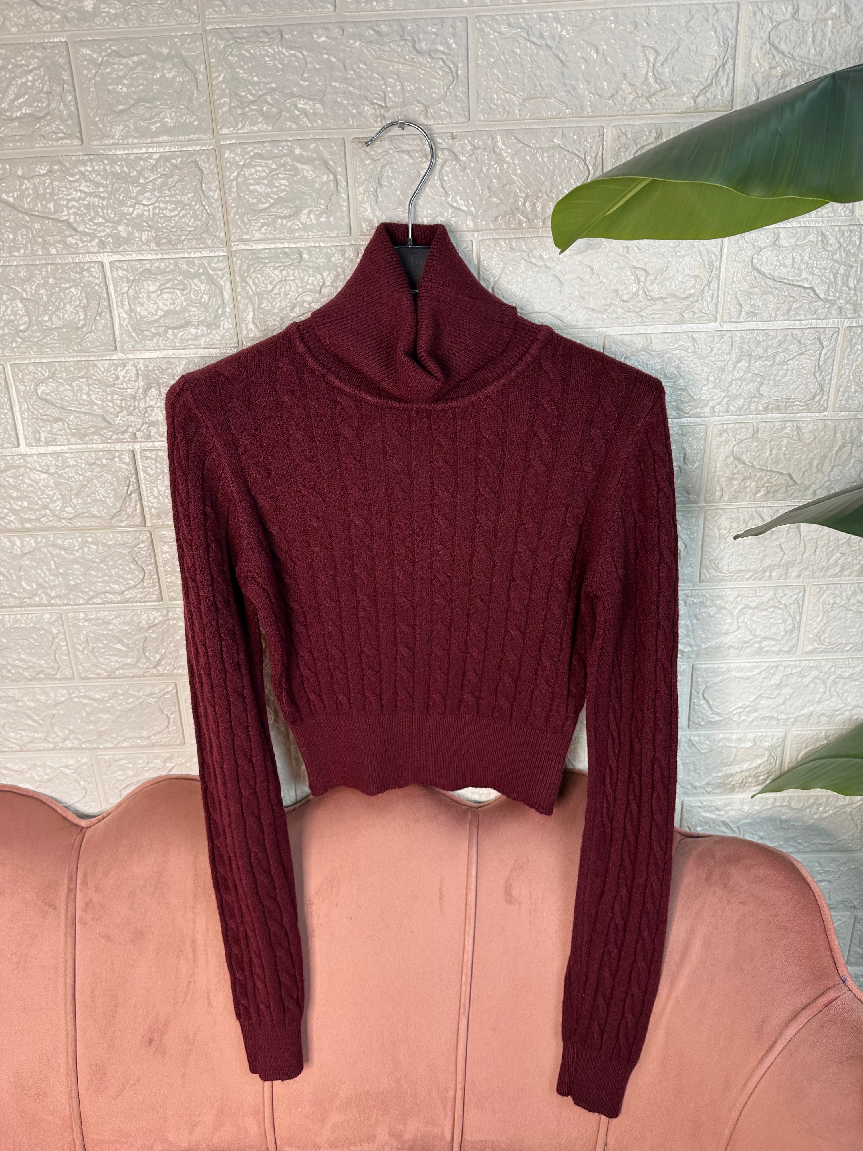 Maglia collo alto trecce