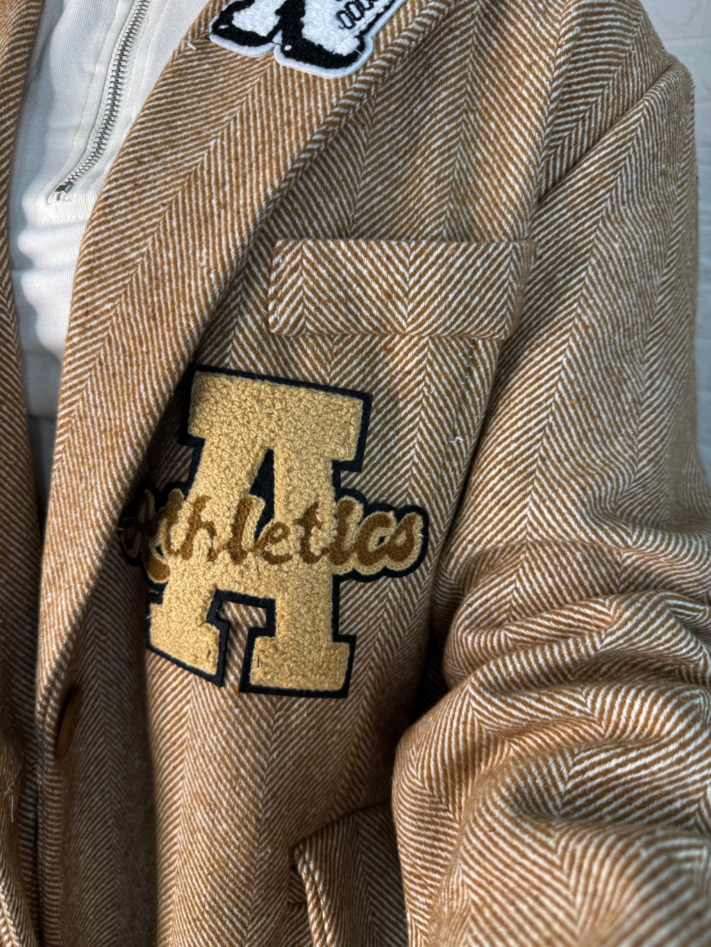 Blazer spigato stemmi