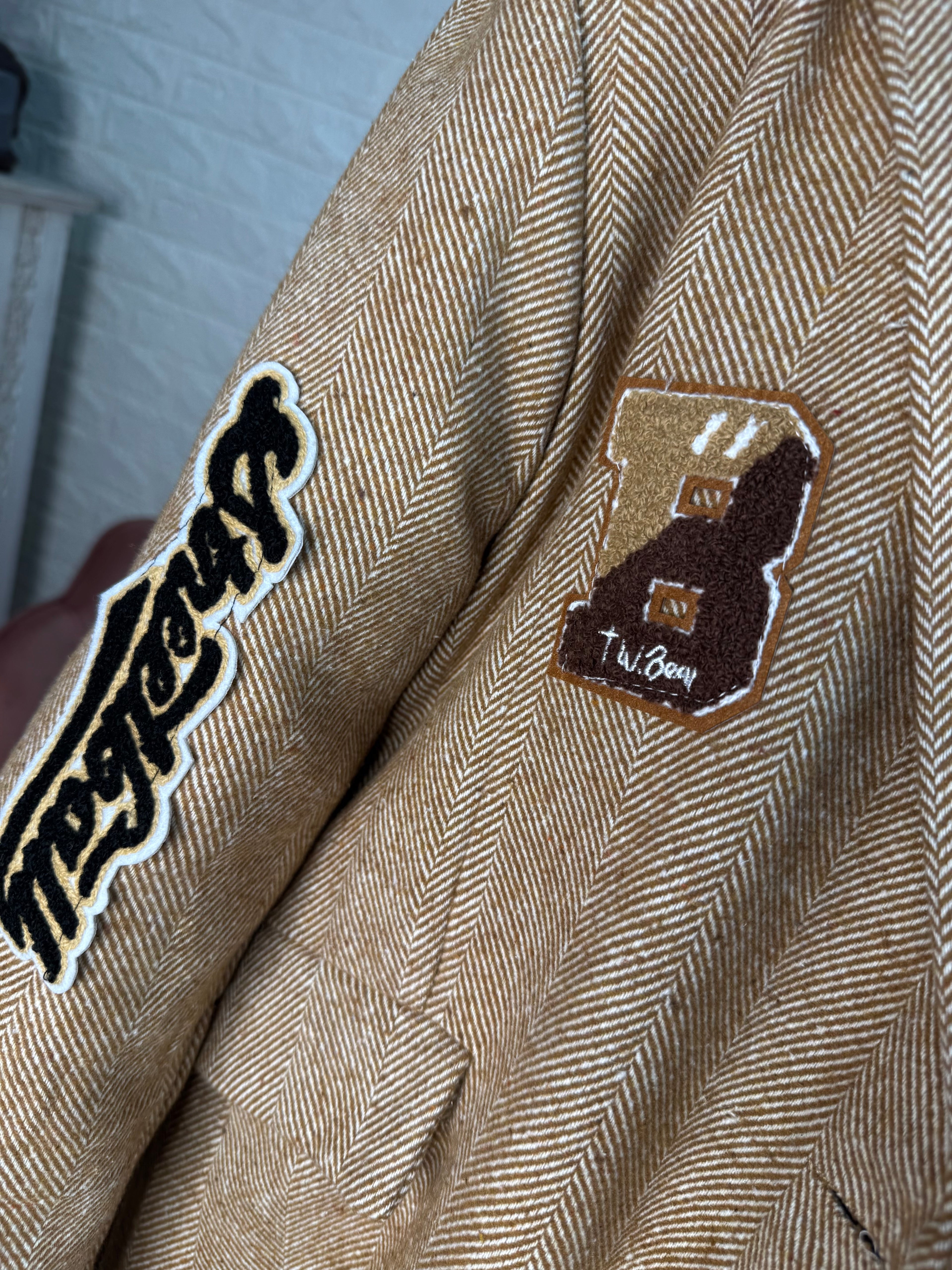 Blazer spigato stemmi