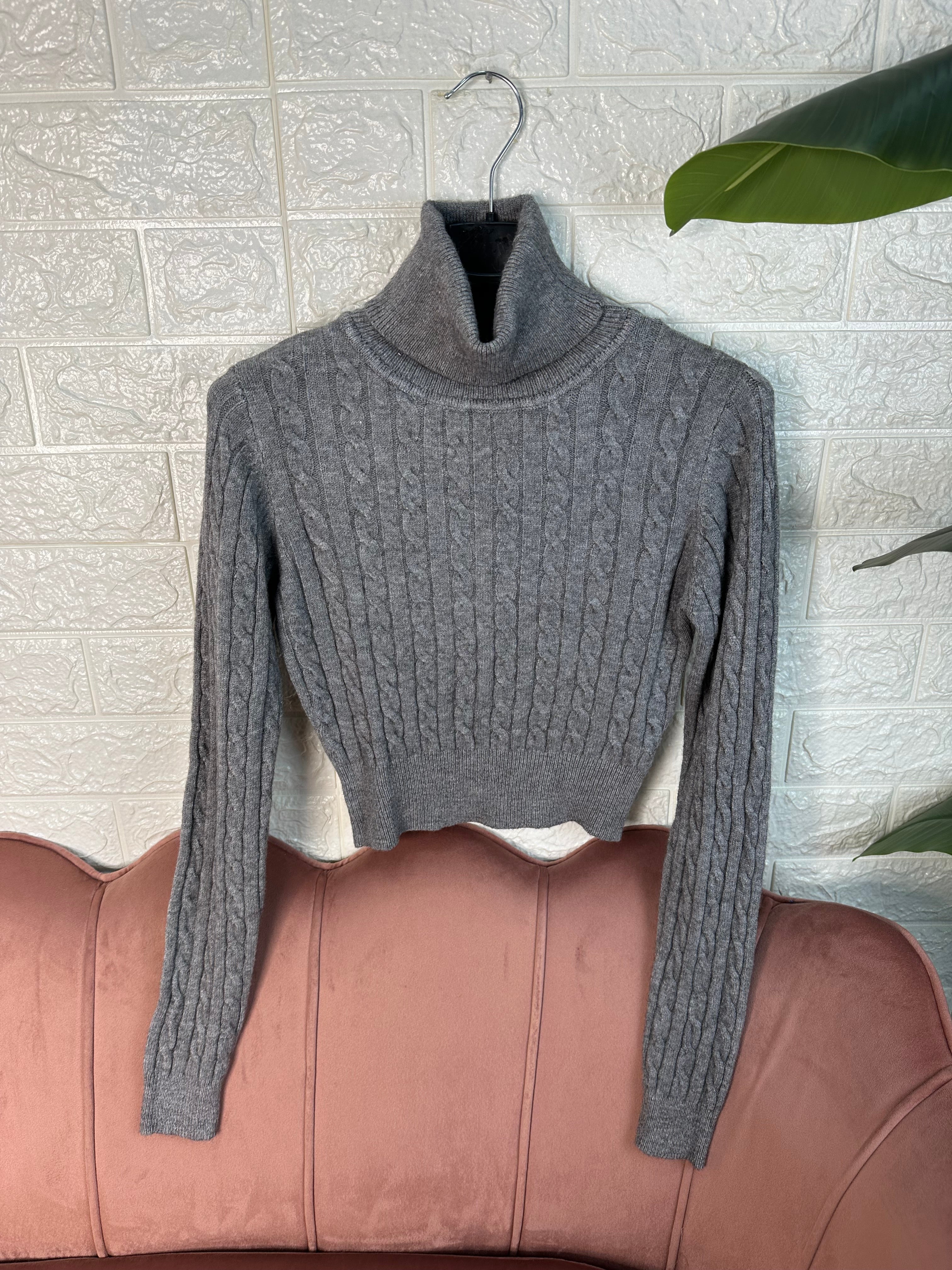 Maglia collo alto trecce